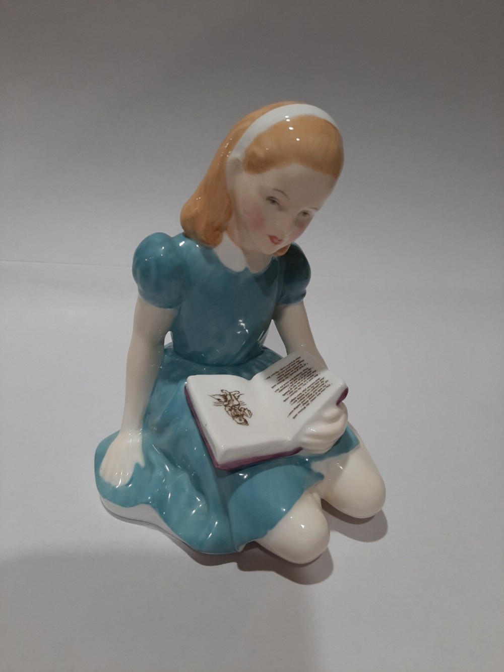 Alice, HN 2168,  $175.00. Royal Doulton figurine